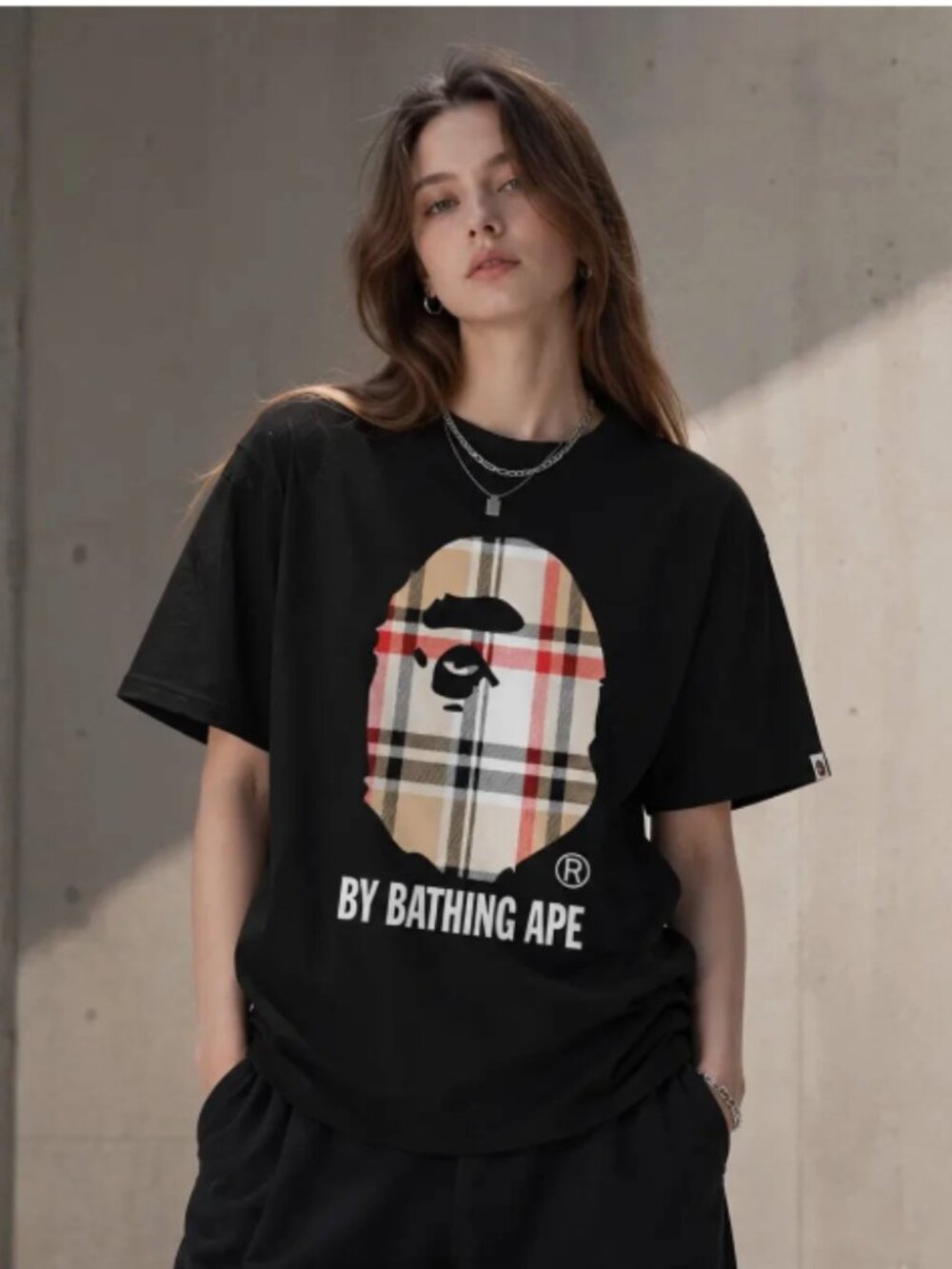 A Bathing Ape Black Short Sleeve Tee with Camo Logo .